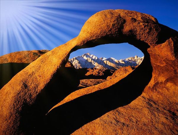 California-Alabama Hills Sun rays and granite arch that frames Lone Pine Peak